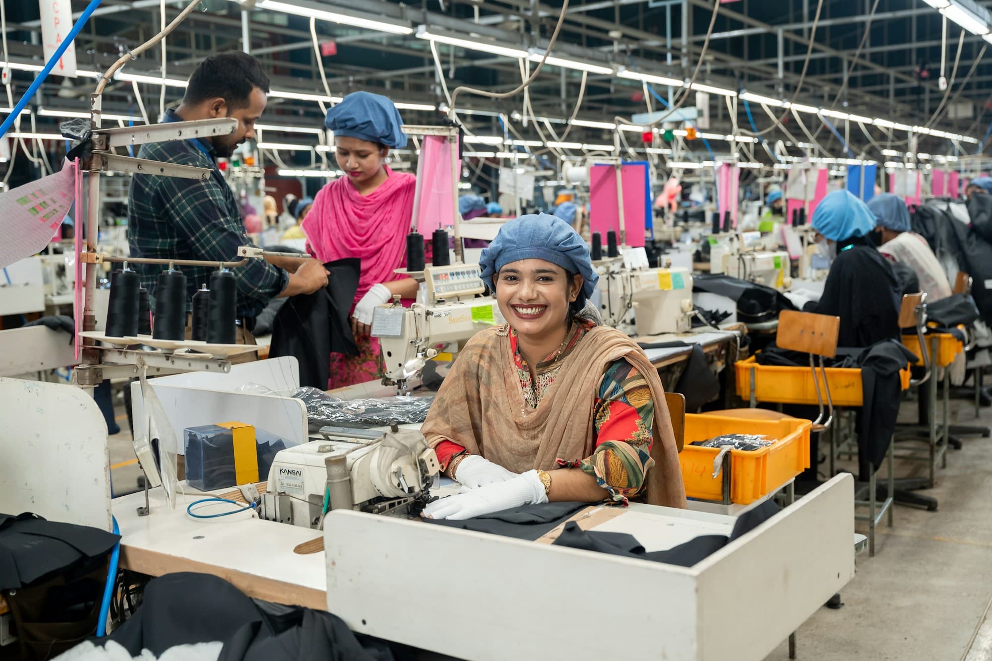 Machinists at their stations on a garment production line